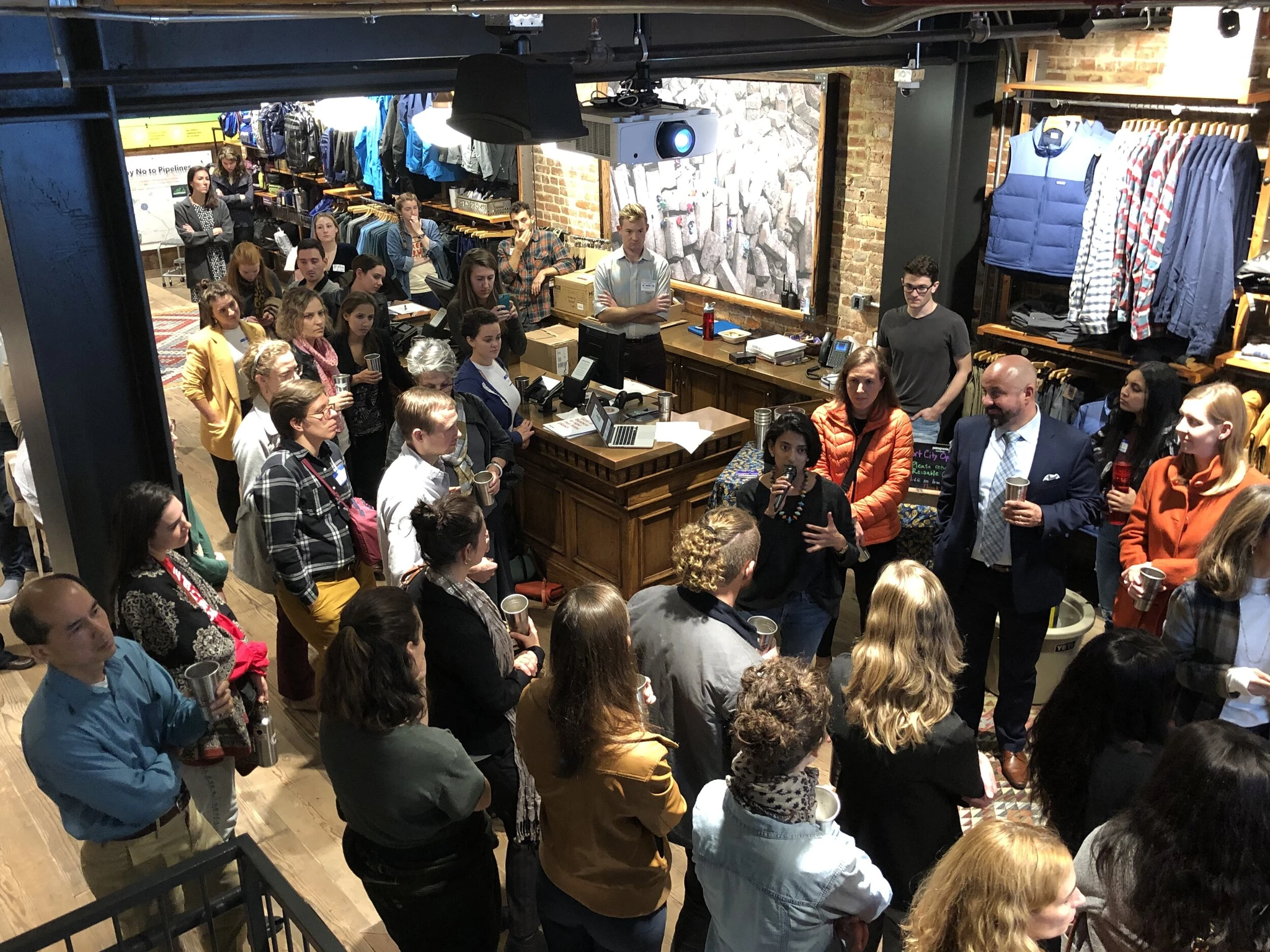  Attendees gathered around to listen to Kaveri Marathe of  Texiles  and the  DC Sustainable Fashion Collective  discuss sustainable fashion at our Circular Clothing Economy event! 